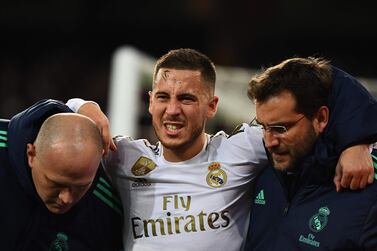 Eden Hazard, centre, fractured his right ankle playing for Real Madrid against Paris Saint-Germain in the Champions League in November. AFP