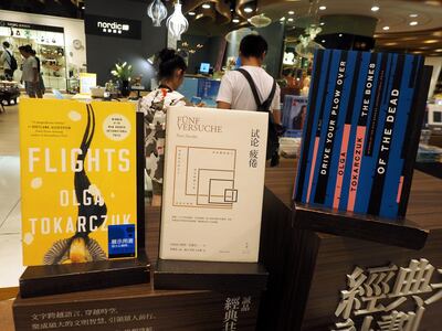 epa07910680 Books by Austrian writer Peter Handke and Polish writer Olga Tokarczuk are displayed in a bookstore in Taipei, Taiwan, 10 October 2019. The Nobel Prize in Literature for 2018 is awarded to Olga Tokarczuk, and the Nobel Prize in Literature for 2019 is awarded to Peter Handke, the Swedish Academy announced on 10 October 2019.  EPA/DAVID CHANG