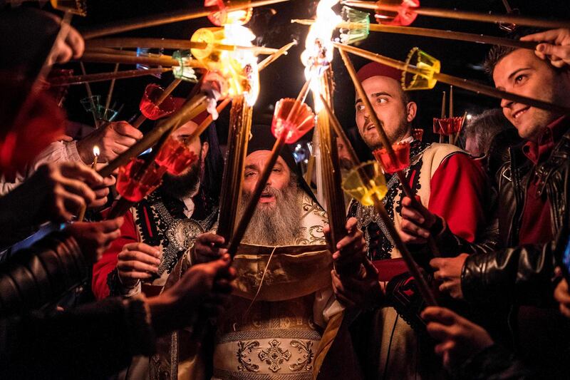 Macedonian Orthodox worshippers light candles during the Easter service at the St Jovan Bigorski monastery, 145km west of the capital Skopje. Robert Atanasovki / AFP