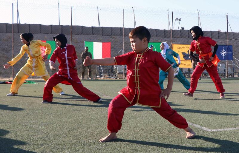 Afghan girls show their skills during an event organised by Nato as part of its mission to distribute aid to Ansar Orphanage and Afghan Women Sports Association, in Herat, Afghanistan. EPA