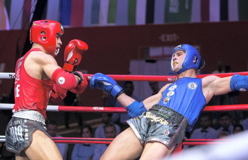 Abu Dhabi, United Arab Emirates - (red UAE) Ilyass Hbibali vs (blue THA) Khaled Tarraf fighting for the IFMA Asian championship at Breakwater.  Ruel Pableo for The National