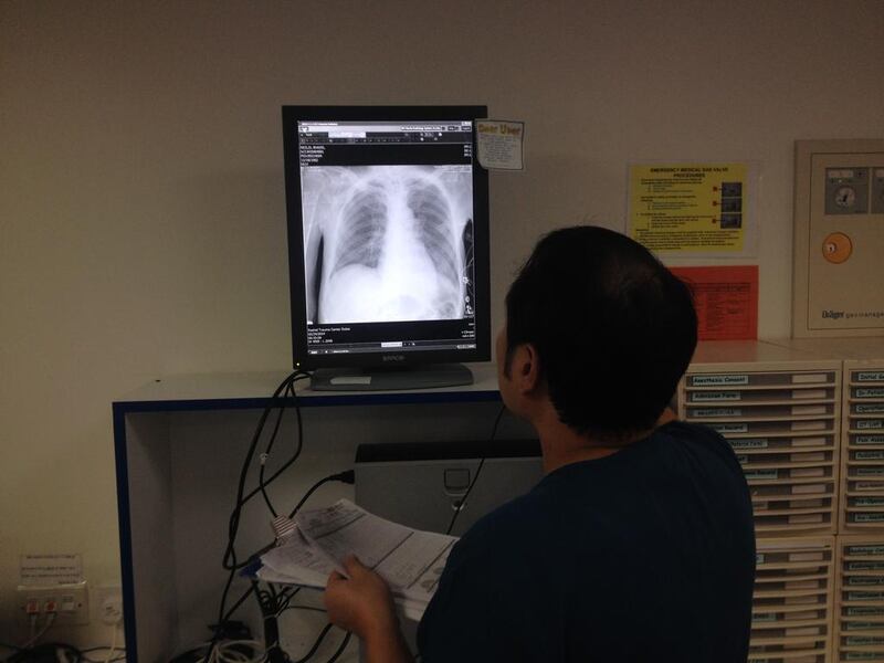 A nurse looking at an X-ray in the Trauma Centre at Rashid Hospital. Jaime Puebla / The National