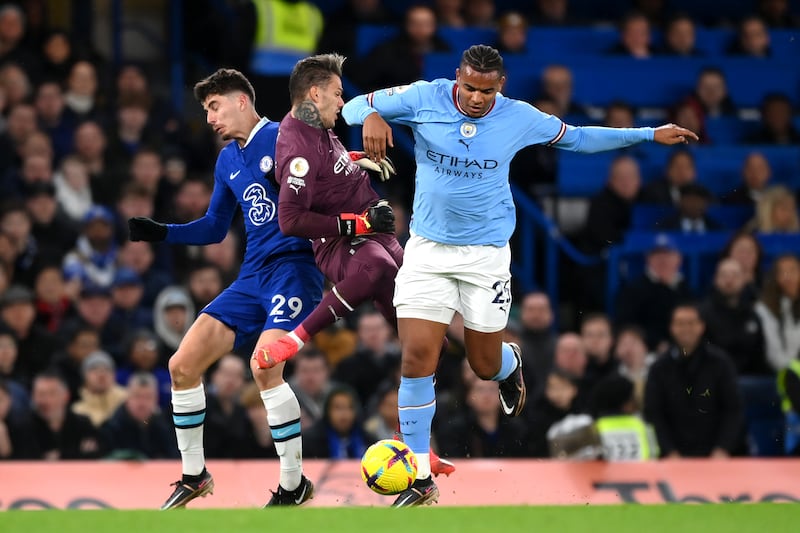Ederson of Manchester City attempts to clear the ball with Manuel Akanji whilst under pressure from Kai Havertz of Chelsea. Getty