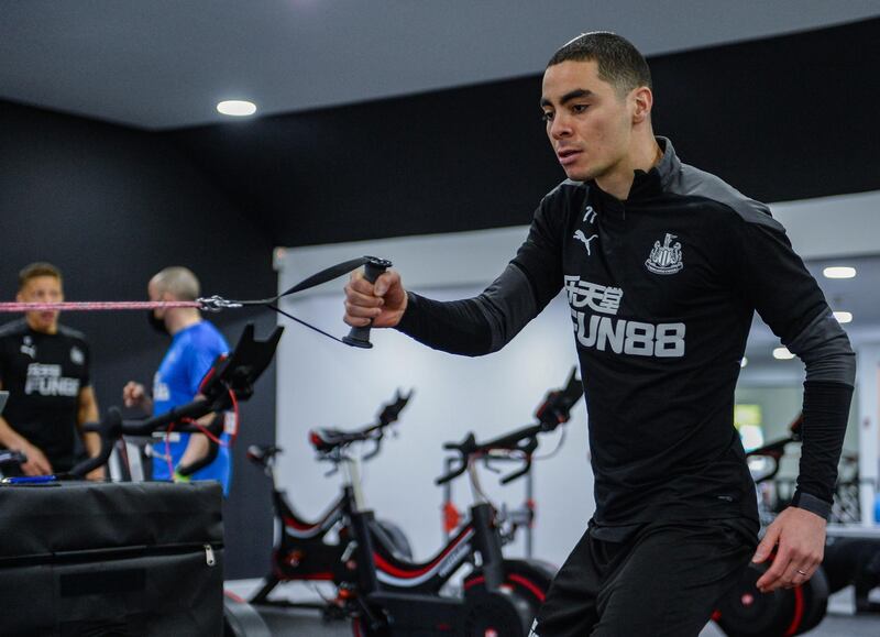 NEWCASTLE UPON TYNE, ENGLAND - APRIL 09: Miguel AlmirÃ³n doing arm pulls during the Newcastle United Training Session at the Newcastle United Training Centre  on April 09, 2021 in Newcastle upon Tyne, England. (Photo by Serena Taylor/Newcastle United via Getty Images)