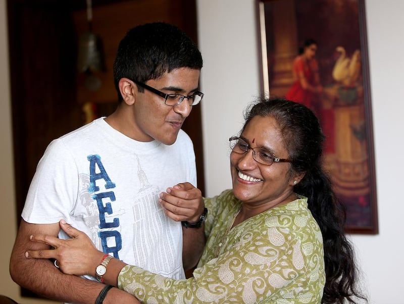 Vineet Nair, 17, celebrates his top-ranking performance in the CBSE science stream examinations with his mother, Kala. Satish Kumar / The National