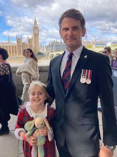 Retired RAF serviceman Jamie Stracker and his daughter Summer, nine, among the last in the queue to see the queen. They travelled 300km overnight from Yorkshire to pay their respects. The National