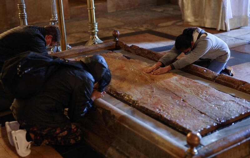 The Stone of Anointing – a small slab with four pillars surmounted by a marble canopy – attracts thousands of pilgrims. AFP