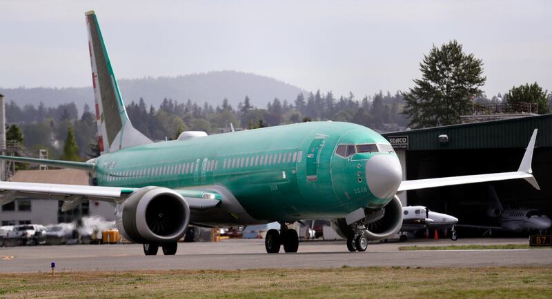 FILE - In this May 8, 2019, file photo a Boeing 737 MAX 8, being built for American Airlines, makes a turn on the runway as it's readied for takeoff on a test flight in Renton, Wash. American Airlines says it is delaying the expected return date for its Boeing 737 Max jets. The airline said Sunday, Sept. 1, that while it â€œremains confidentâ€ that coming software updates and training will mean recertification of the aircraft this year, it is extending cancellations for Max flights through Dec. 3. (AP Photo/Elaine Thompson, File)