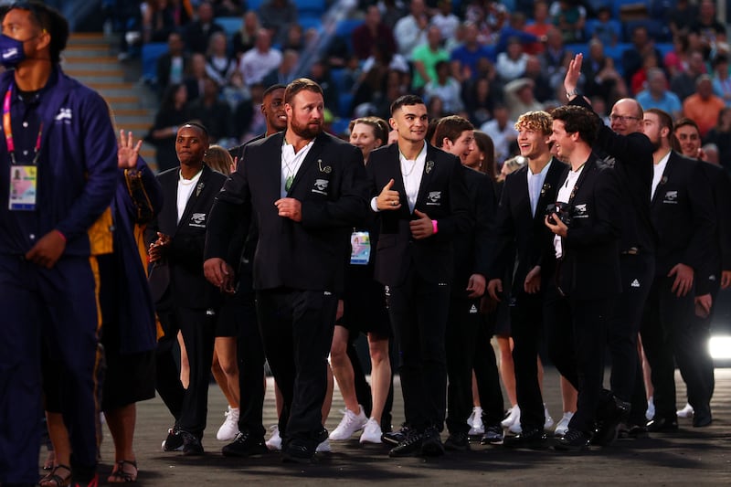Athletes of Team New Zealand in fine suits. Getty Images