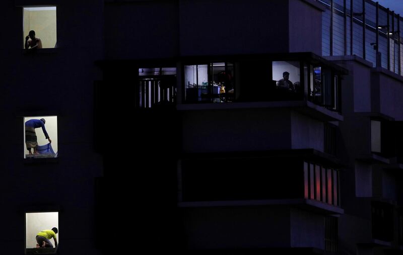 Migrant workers pray in their dormitory during the holy month of Ramadan, amid the coronavirus disease (COVID-19) outbreak, in Singapore May 8, 2020. Picture taken May 8, 2020. REUTERS/Edgar Su