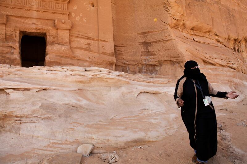A visitor walks through the ruins of Qasr Al-Bint at the ancient rock heritage site at Al Ula, Saudi Arabia. Saudi Arabia's Crown Prince Mohammed Bin Salman officially launched his vision of the mega tourism project at the ancient site of Al Ula. Bloomberg