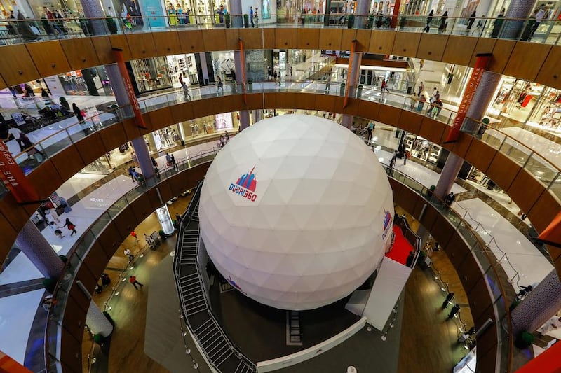 Dubai Mall shoppers can step inside the giant ball in the Star Atrium, walking along a suspended footbridge to the centre of the ball, and experience a fast-paced six-minute film of Dubai shot in 360 degrees. Victor Besa for The National