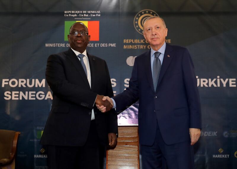 Senegal's President Macky Sall, left, greets Turkish President Recep Tayyip Erdogan in Dakar, Senegal, February 21, 2022. EPA / Turkish President Press Office Handout