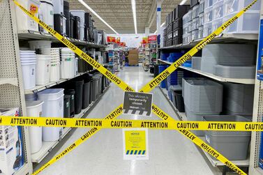FILE PHOTO: An aisle of non-essential goods is seen cordoned off at a Walmart store, as new measures are imposed on big box stores due to the coronavirus disease (COVID-19) pandemic, in Toronto, Ontario, Canada April 8, 2021. REUTERS/Carlos Osorio 