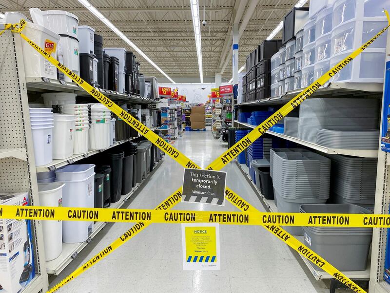 FILE PHOTO: An aisle of non-essential goods is seen cordoned off at a Walmart store, as new measures are imposed on big box stores due to the coronavirus disease (COVID-19) pandemic, in Toronto, Ontario, Canada April 8, 2021. REUTERS/Carlos Osorio     TPX IMAGES OF THE DAY/File Photo