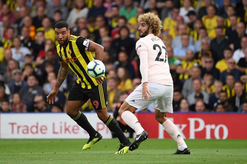 WATFORD, ENGLAND - SEPTEMBER 15:  Troy Deeney of Watford challenges for the ball with Marouane Fellaini of Manchester United during the Premier League match between Watford FC and Manchester United at Vicarage Road on September 15, 2018 in Watford, United Kingdom.  (Photo by Ross Kinnaird/Getty Images)