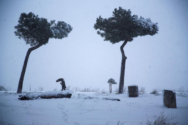 A man walks in the snow in Rome, Italy. Alessandro Bianchi / Reuters