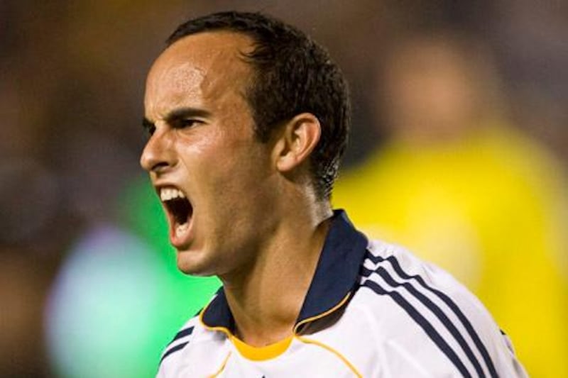 Los Angeles Galaxy's Landon Donovan celebrates scoring a hat trick against D.C. United during the second half of an MLS soccer match in Carson, Calif., Saturday, Sept. 20, 2008. The Galaxy won 5-2. (AP Photo/Mark Avery)