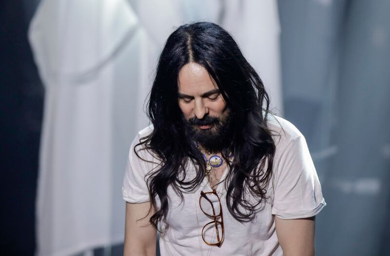 FILE - Designer Alessandro Michele acknowledges the applause of the audience at the end of Gucci's Fall/Winter 2020/2021 collection, presented in Milan, Italy, Feb, 19, 2020.  Michele is leaving his role as creative director of the Gucci, the fashion house announced Wednesday, Nov.  23, 2022 bringing an end to an eight-year tenure that sharply redefined Gucci’s codes with romanticism and gender-fluidity, all the while powering revenues for the Kering parent.  (AP Photo / Luca Bruno, File)