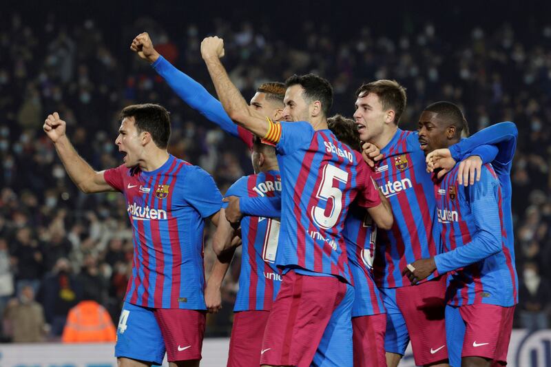 Barcelona players celebrate taking a 3-2 lead during the La Liga win against Elche. EPA