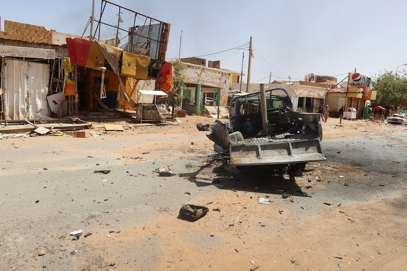 A damaged car and houses in Omdurman, Sudan. Reuters
