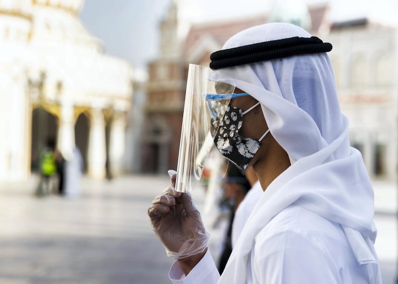 DUBAI, UNITED ARAB EMIRATES. 25 OCTOBER 2020. 
Checkers line up at the entrance of Global Village. GV celebrates it’s 25th season this year.
(Photo: Reem Mohammed/The National)

Reporter:
Section: