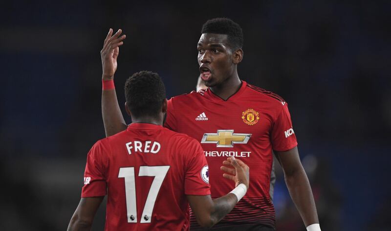 Manchester United players Fred and Paul Pogba celebrate. Getty Images