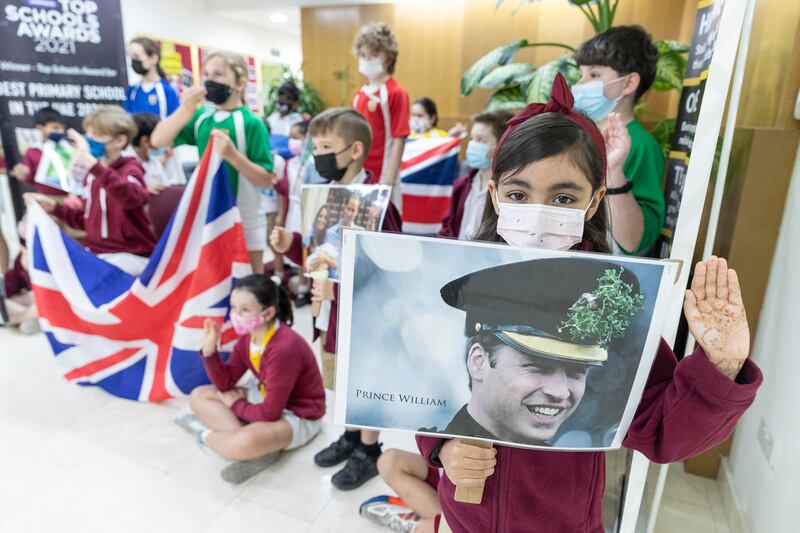 Pupils wave the Union Jack flag ahead of royal visit to Dubai. 
