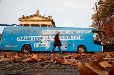 Pro-European Union (EU), anti-Brexit campaigners from the Our Future, Our Choice (OFOC) youth movement for a 'People's Vote' on Brexit, launch the group's campaign battle bus in London on November 17, 2018, as part of their "Stand Up For Our Future!" campaign aimed at highlighting the youth feeling around Brexit. British Prime Minister Theresa May battled Friday to salvage a draft Brexit deal and her own political future. / AFP / Tolga Akmen
