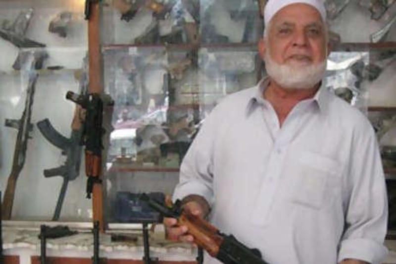 Shah Mahmood at his arms shop in Darra Adam Khel. The famous Pakistani arms bazaar has been under Taliban control for months.