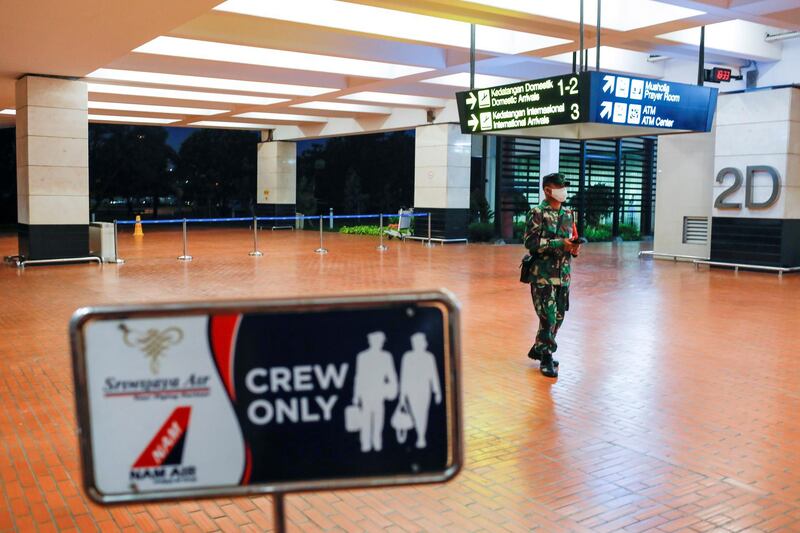 An Indonesian soldier walks at Soekarno-Hatta International Airport after Sriwijaya Air plane flight SJ182 with more than 50 people on board lost contact after taking off, according to local media, in Tangerang, near Jakarta, Indonesia. Reuters