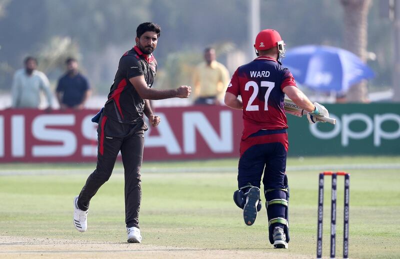 ABU DHABI , UNITED ARAB EMIRATES , October 22  – 2019 :- Junaid Siddique of UAE ( left ) celebrating after taking the wicket of Ben Ward during the World Cup T20 Qualifiers between UAE vs Jersey held at Tolerance Oval cricket ground in Abu Dhabi.  ( Pawan Singh / The National )  For Sports. Story by Paul