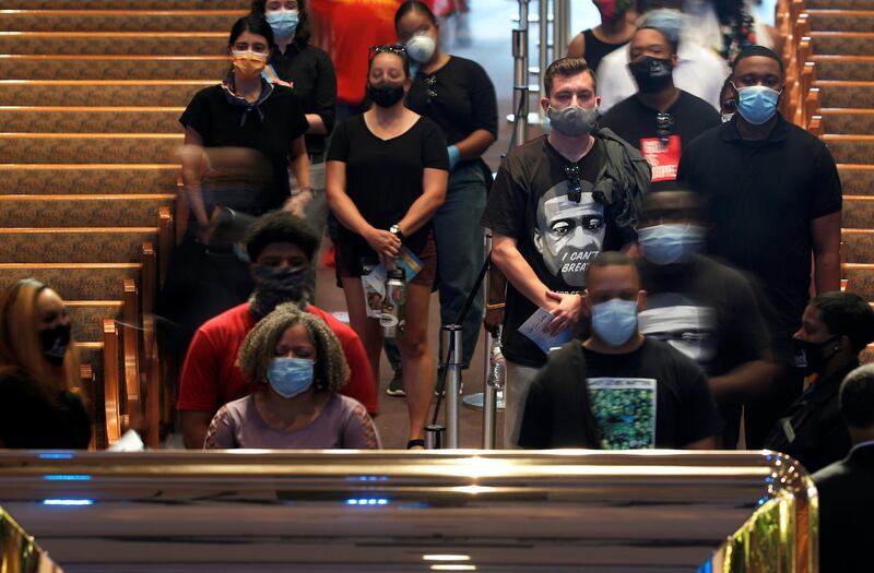 People pay their respects during a memorial for George Floyd, whose death in Minneapolis police custody has sparked nationwide protests against racial inequality, in Houston, Texas. Reuters