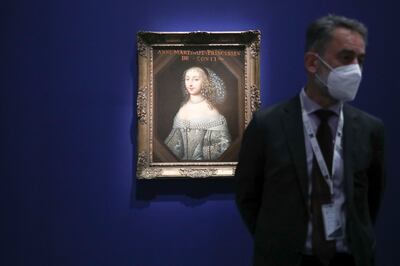  Bertrand Rondot, co-curator of 'Versailles and the World', with the oil painting of Anna Maria Martinozzi, Princess of Conti. Khushnum Bhandari / The National 

