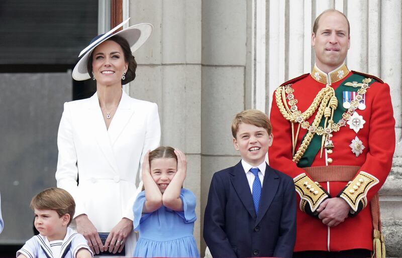 Prince Louis, Princess Charlotte and Prince George with their parents watch the RAF flypast on the balcony of Buckingham Palace during the Trooping the Colour parade in June 2022. Getty