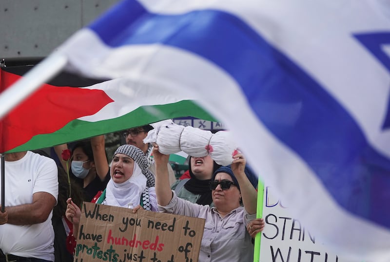 Protesters in Florida, US, gather to denounce Israeli actions in Gaza, while supporters of Israel demonstrate across the street. AP