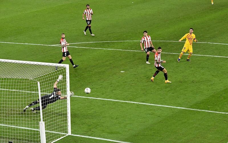 Barcelona's Lionel Messi scores their third goal. AP