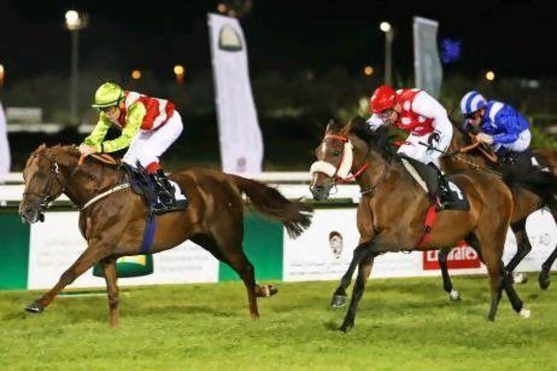 Gerald Avranche, left, rides Nieshan to victory in the National Day Cup Prep race for Arabians at Abu Dhabi Equestrian Club. Pawan Singh / The National