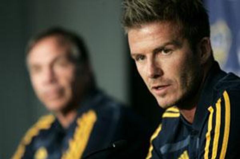 Los Angeles Galaxy's David Beckham, right, of England, and his coach Bruce Arena.