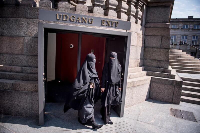 epa06775165 Women wearing the niqab exit the Danish Parliament at Christiansborg Castle in Copenhagen, Denmark, 31 May 2018. A majority in the Danish Parliament adopted a ban wearing niqab or burka in public.  EPA/Mads Claus Rasmussen  DENMARK OUT