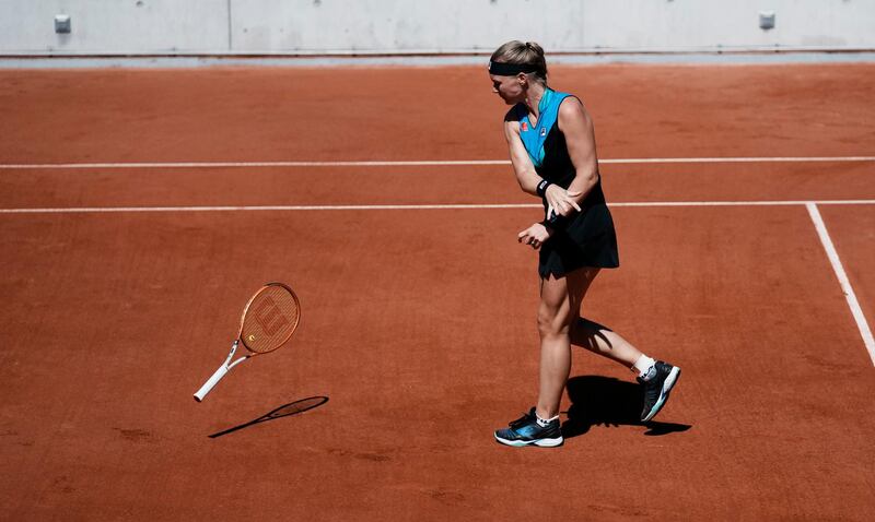 Dutch player Kiki Bertens throws down her racket down during her defeat against Slovenia's Polona Hercog. AP