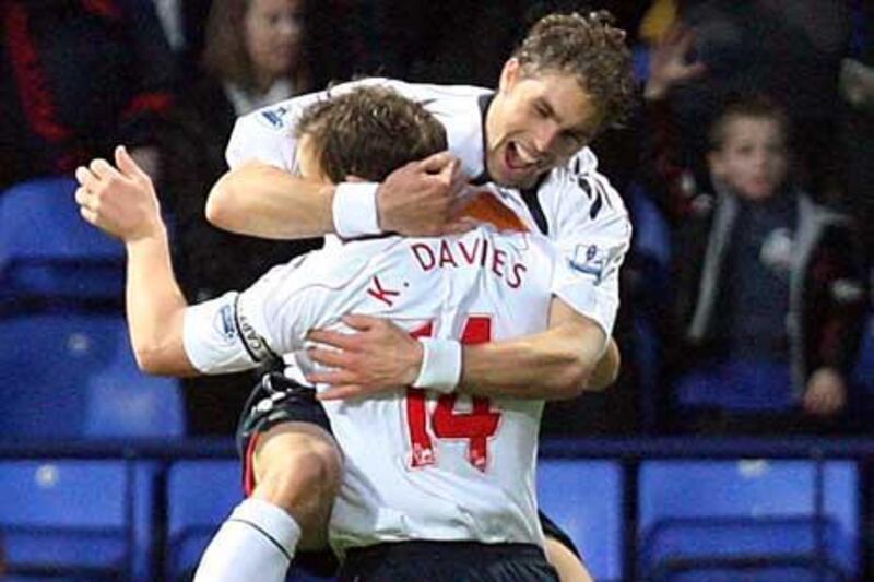 Kevin Davies celebrates with Johan Elmander; the pair have netted 14 times between them in the league so far.