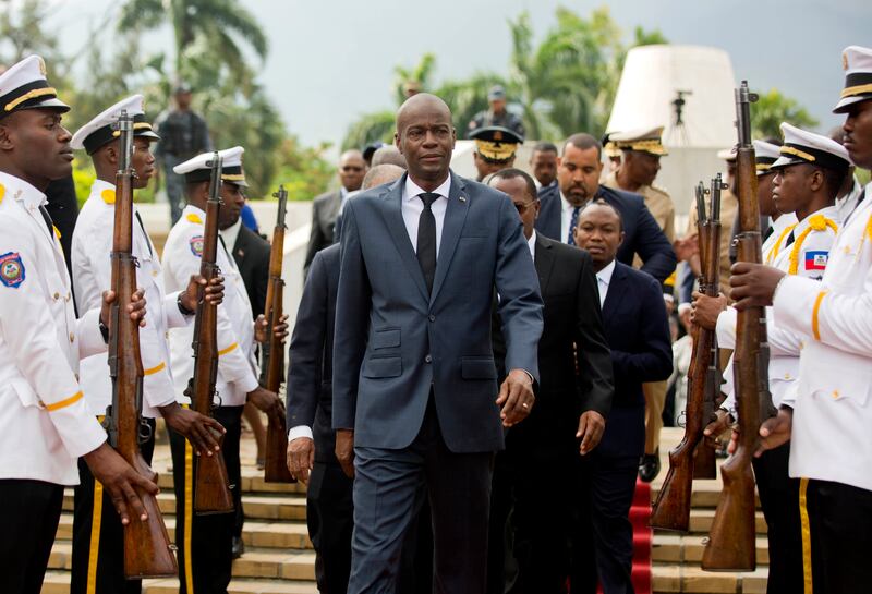 Haiti's President Jovenel Moise, centre, at a ceremony marking the 215th anniversary of revolutionary hero Toussaint Louverture's death, at the National Pantheon Museum in Port-au-Prince, April 2018.