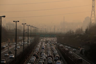 Traffic moves slowly on a motorway in Tehran as high levels of air pollution engulf the city. AFP