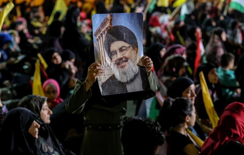 epa07616569 Hezbollah Supporters listen to Lebanon's Hezbollah leader Hassan Nasrallah delivers a speech via a big screen during a gathering to commemorate the 'Al-Quds (Jerusalem) International Day' in southern suburb of Beirut, Lebanon, 31 May 2019. Many Muslim countries demonstrate on the last Friday of the holy month of Ramadan, to mark Al-Quds day, and to express solidarity with the Palestinian people. Al-Quds (Jerusalem) International Day is an annual event opposing Israel's occupation of the Palestinian territories. Anti-Zionist demonstrations are held on this day in some Muslim and Arab countries and by Muslim and Arab communities around the world, but especially in Iran where the occasion was first suggested.  EPA/NABIL MOUNZER