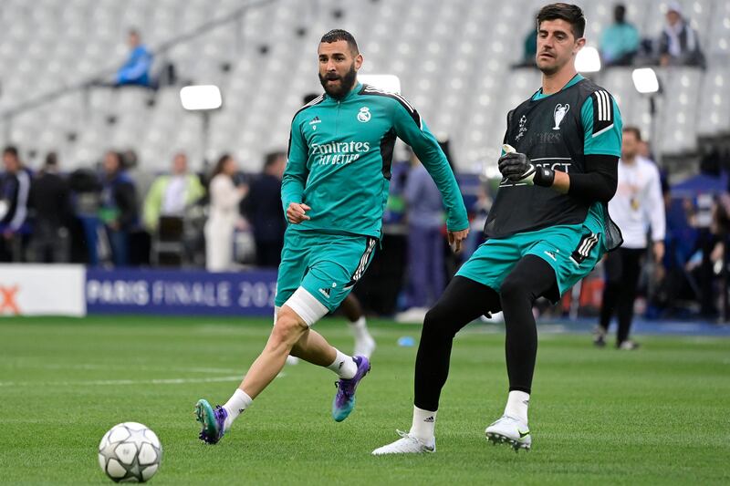 Karim Benzema and Real Madrid goalkeeper Thibaut Courtois take part in a training session. AFP