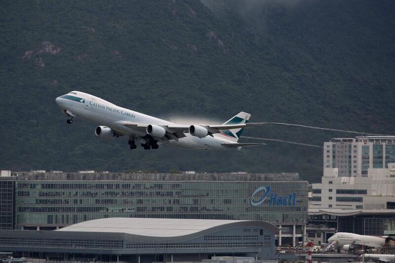 A Cathay Pacific plane takes off from Hong Kong International Airport. The airline is facing stiff competition from Chinese mainland carriers and is expected to announce job cuts this week. Jerome Favre / EPA