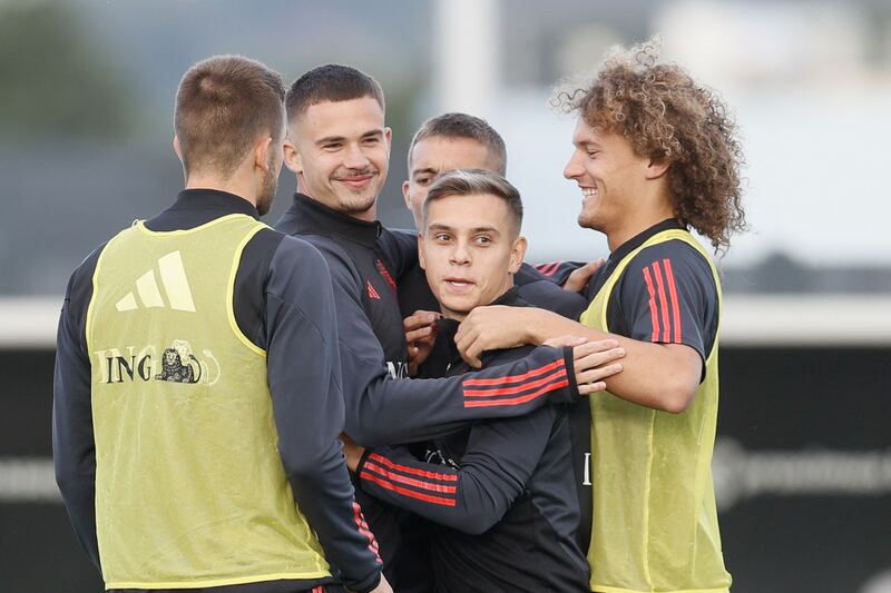 Leander Dendoncker, Leandro Trossard and Wout Faes take part in a training session. AFP