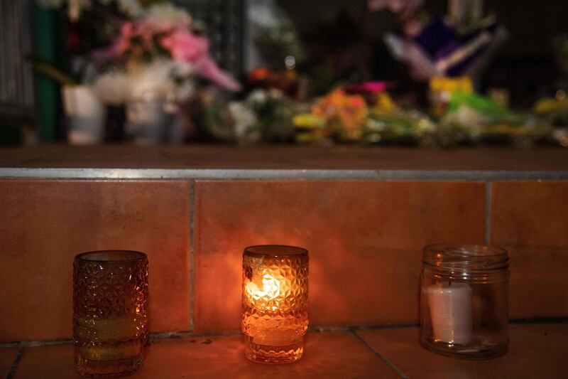 Flowers and candles are placed on the front steps of the Wellington Masjid mosque in Kilbirnie. AFP