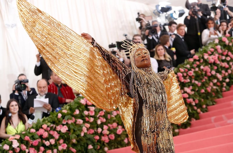 Once arrived, Billy Porter wore a gold sequined cat suit with golden feathered 'wings.' Reuters